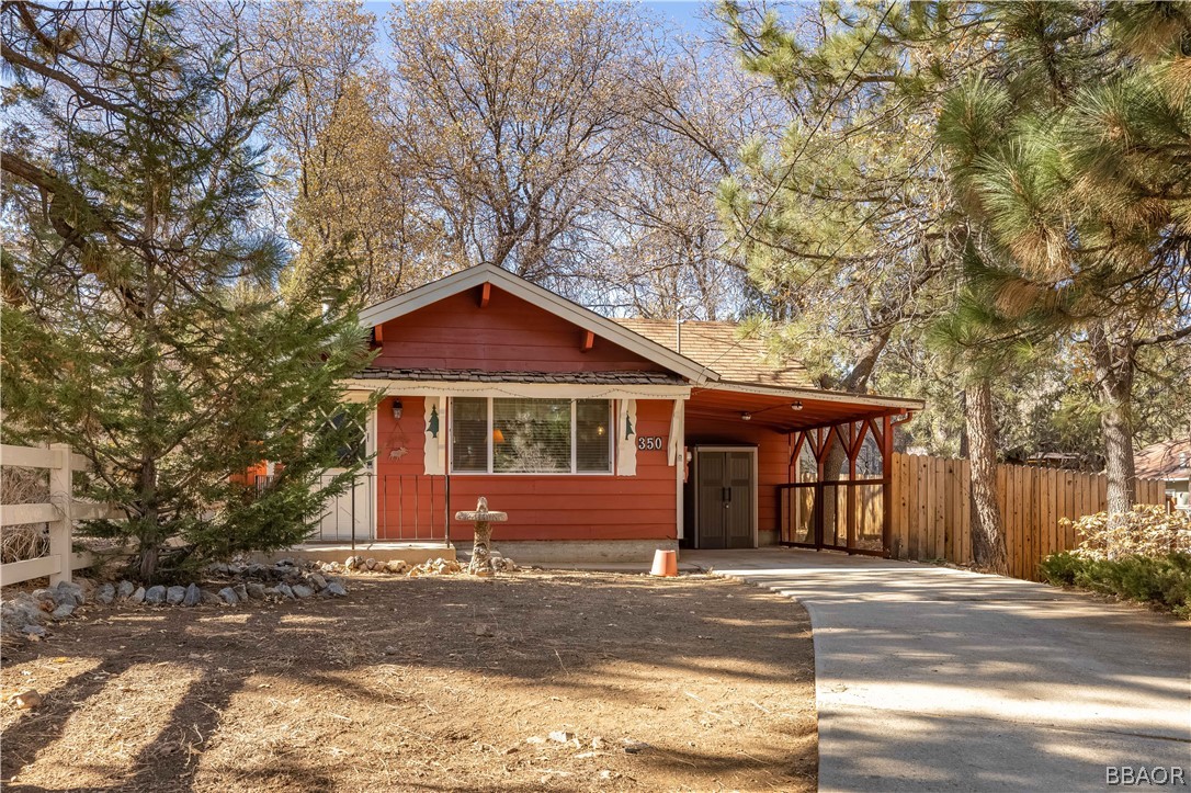 350 Riverside Avenue Sugarloaf, CA 92386 - Photo 1 of 25 a front view of a house with a yard