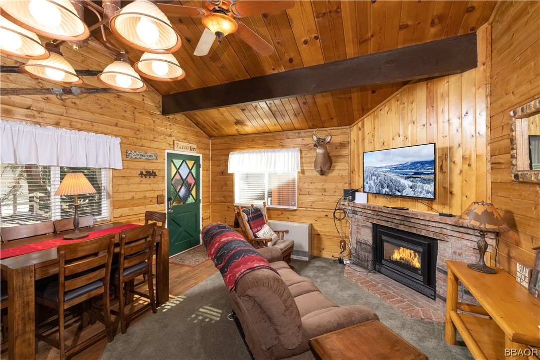 350 Riverside Avenue Sugarloaf, CA 92386 - Photo 8 of 25 a living room with furniture and a fireplace