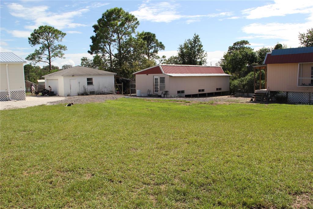 13127 Star Road Brooksville, FL 34613 - Photo 52 of 54 a house view with a garden space