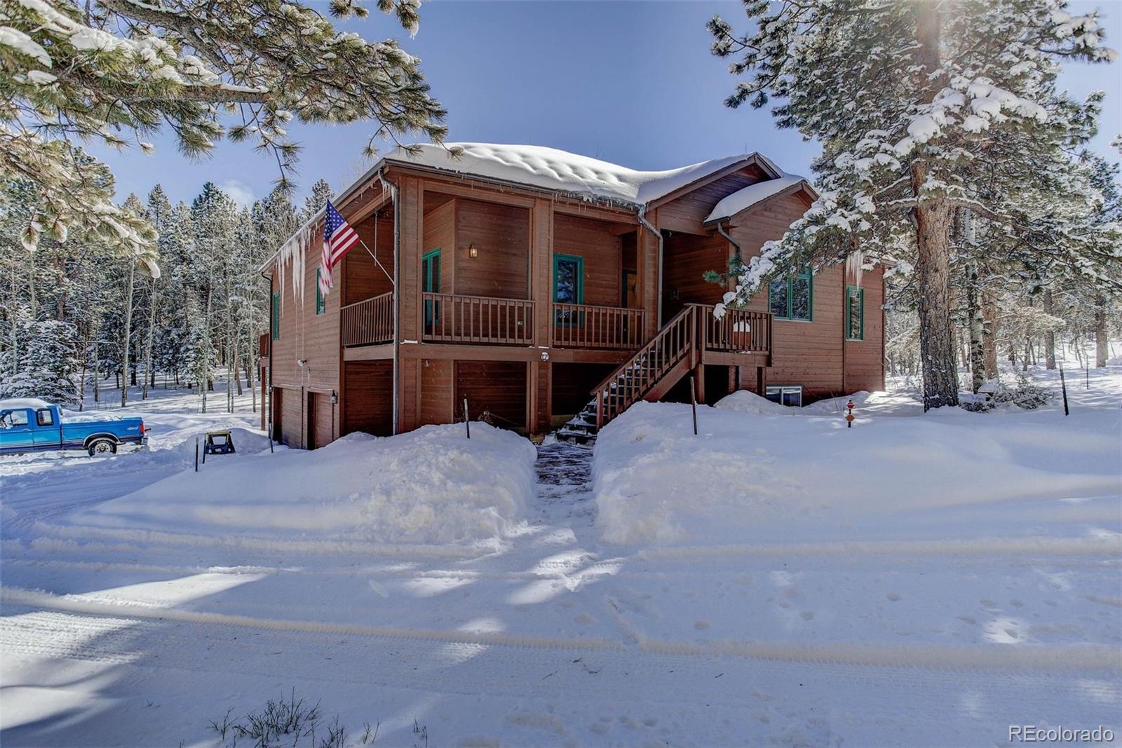 11800 South Ridge Road Conifer, CO 80433 - Photo 2 of 35 a view of a house with a wooden fence