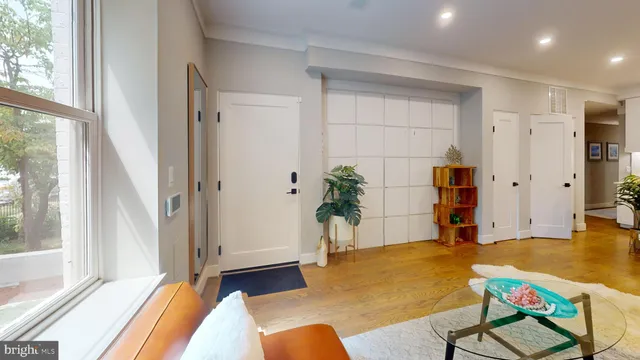 a bedroom with a bed and a table in it