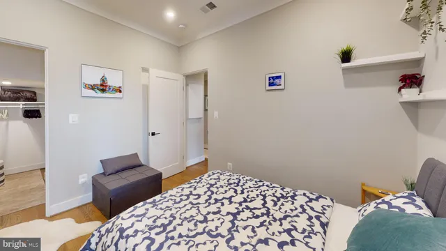 a bedroom with a bed and a couch