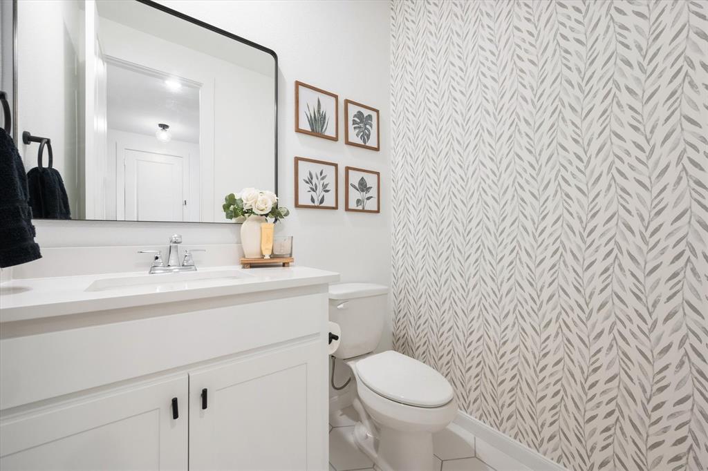 208 Scottish Way Mansfield, TX 76063 - Photo 19 of 38 Half bath featuring vanity and tile patterned flooring!