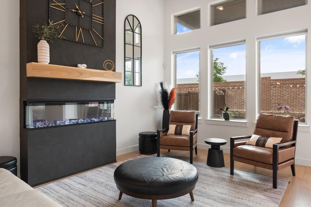 208 Scottish Way Mansfield, TX 76063 - Photo 5 of 38 Electric fireplace does put off heat, changes colors as selected!