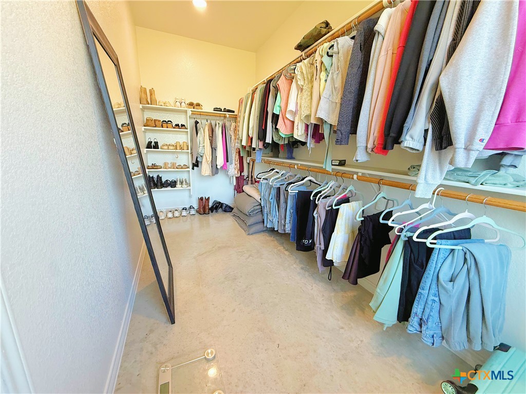 211 Riptide Road Temple, TX 76501 - Photo 7 of 11 a view of walk in closet with clothes and shoes
