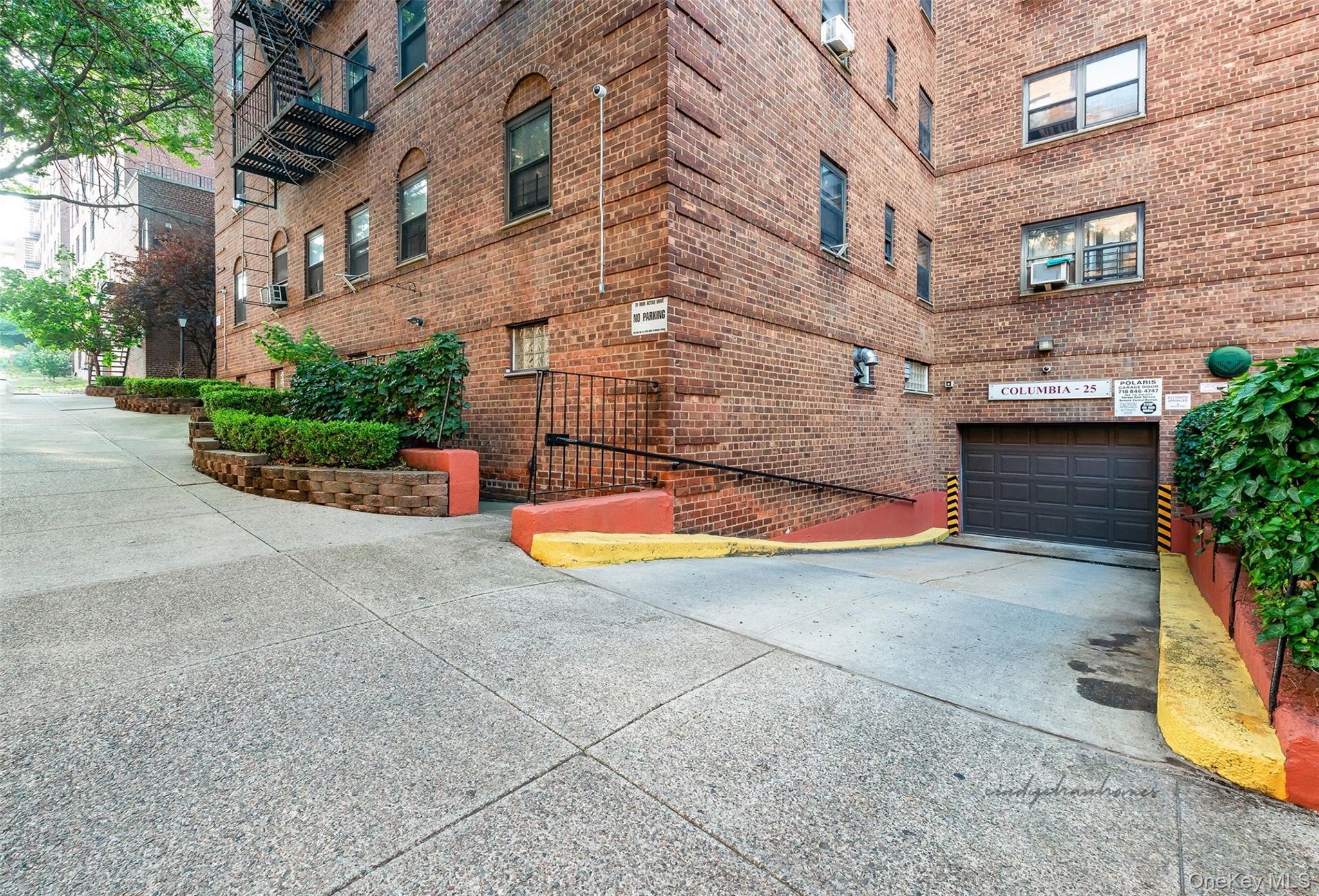 102-25 67th Road, Unit 3C Queens, NY 11375 - Photo 17 of 17 View of building exterior with concrete driveway