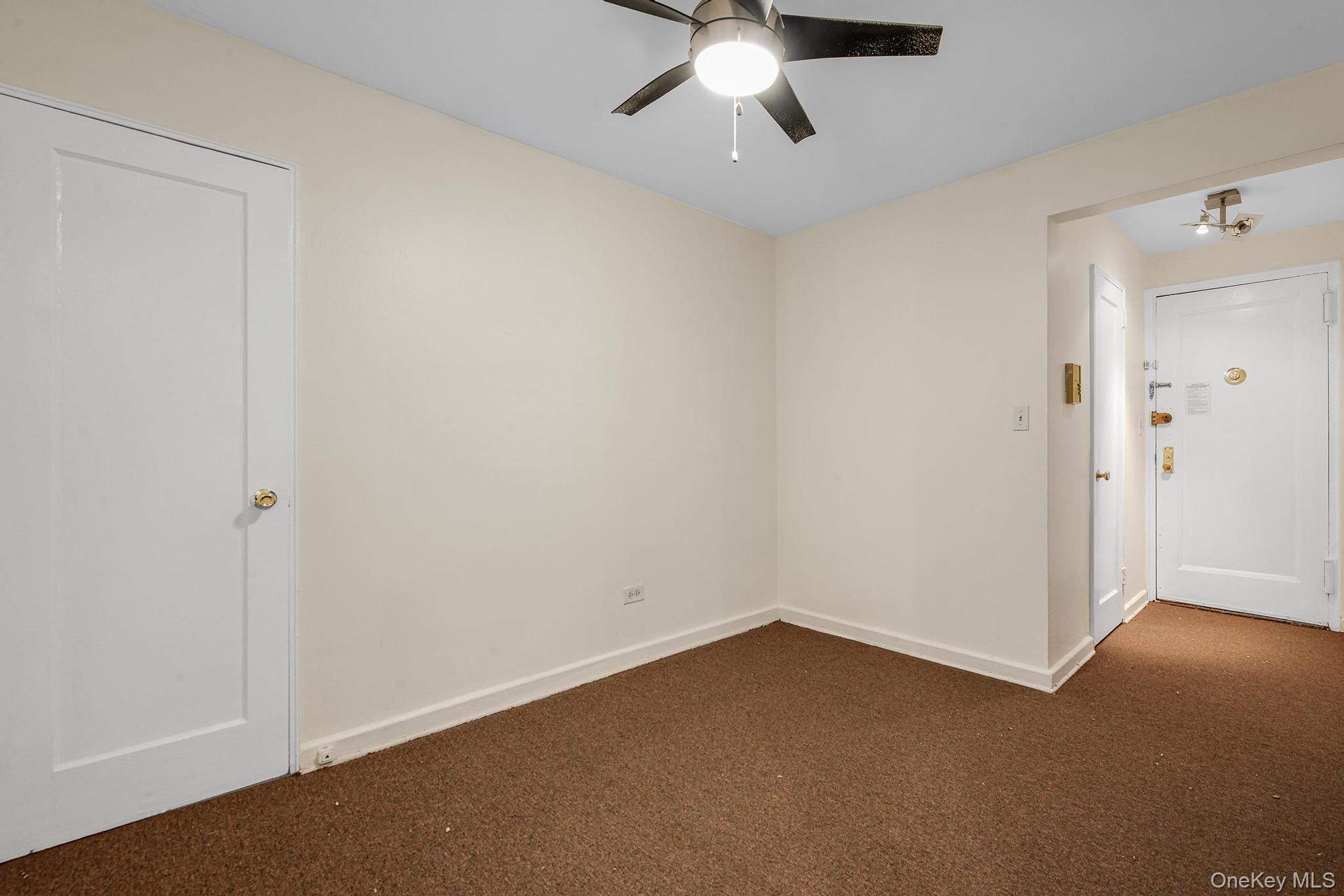 102-25 67th Road, Unit 3C Queens, NY 11375 - Photo 6 of 17 Spare room with carpet floors and ceiling fan