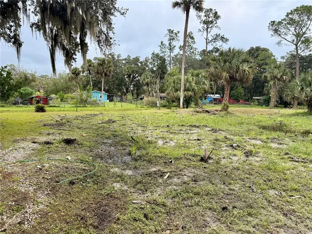 a view of a golf course with a trees