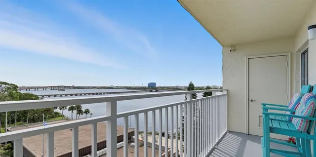 a view of balcony with furniture