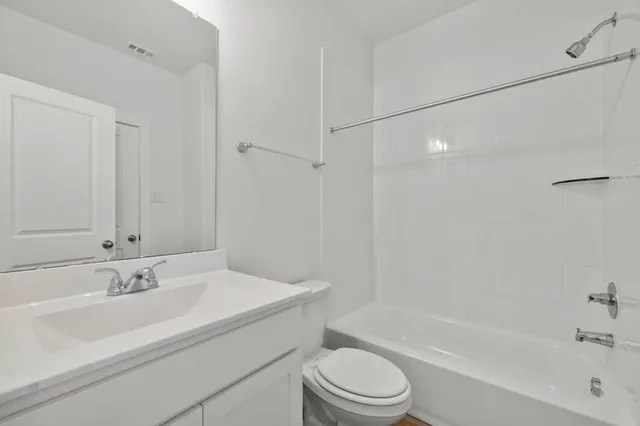 a bathroom with a sink toilet and bathtub