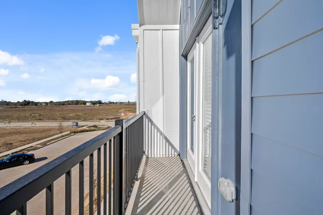a view of a balcony with an ocean view