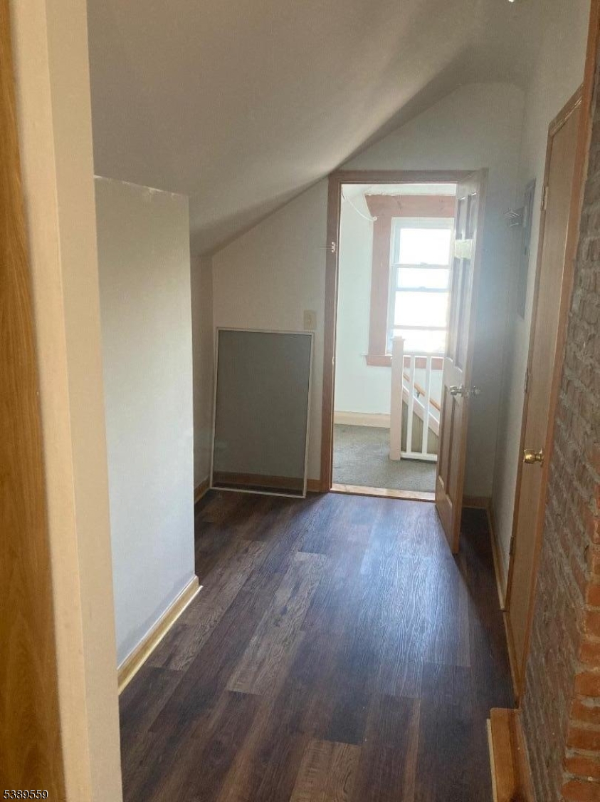 9 Orchard Street Passaic, NJ 07055 - Photo 12 of 19 a view of a room with wooden floor and a window