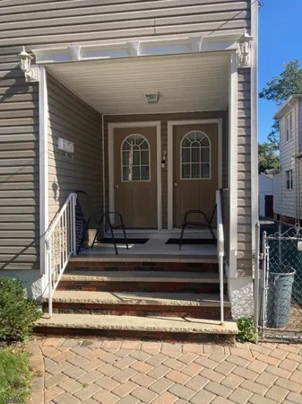 a front view of a house with a porch