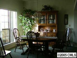 9837 Fairway Ridge Road Charlotte, NC 28277 - Photo 5 of 8 a view of a dining room with furniture and window
