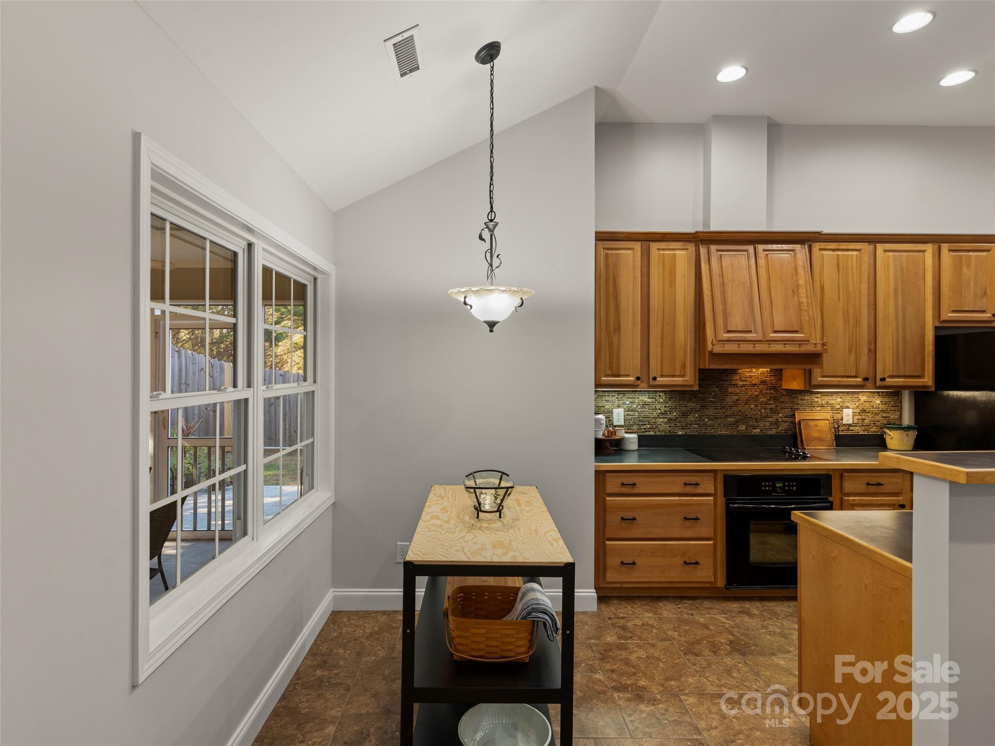 57 Regent Drive Fletcher, NC 28732 - Photo 13 of 33 a kitchen with stainless steel appliances granite countertop a stove a sink and a refrigerator