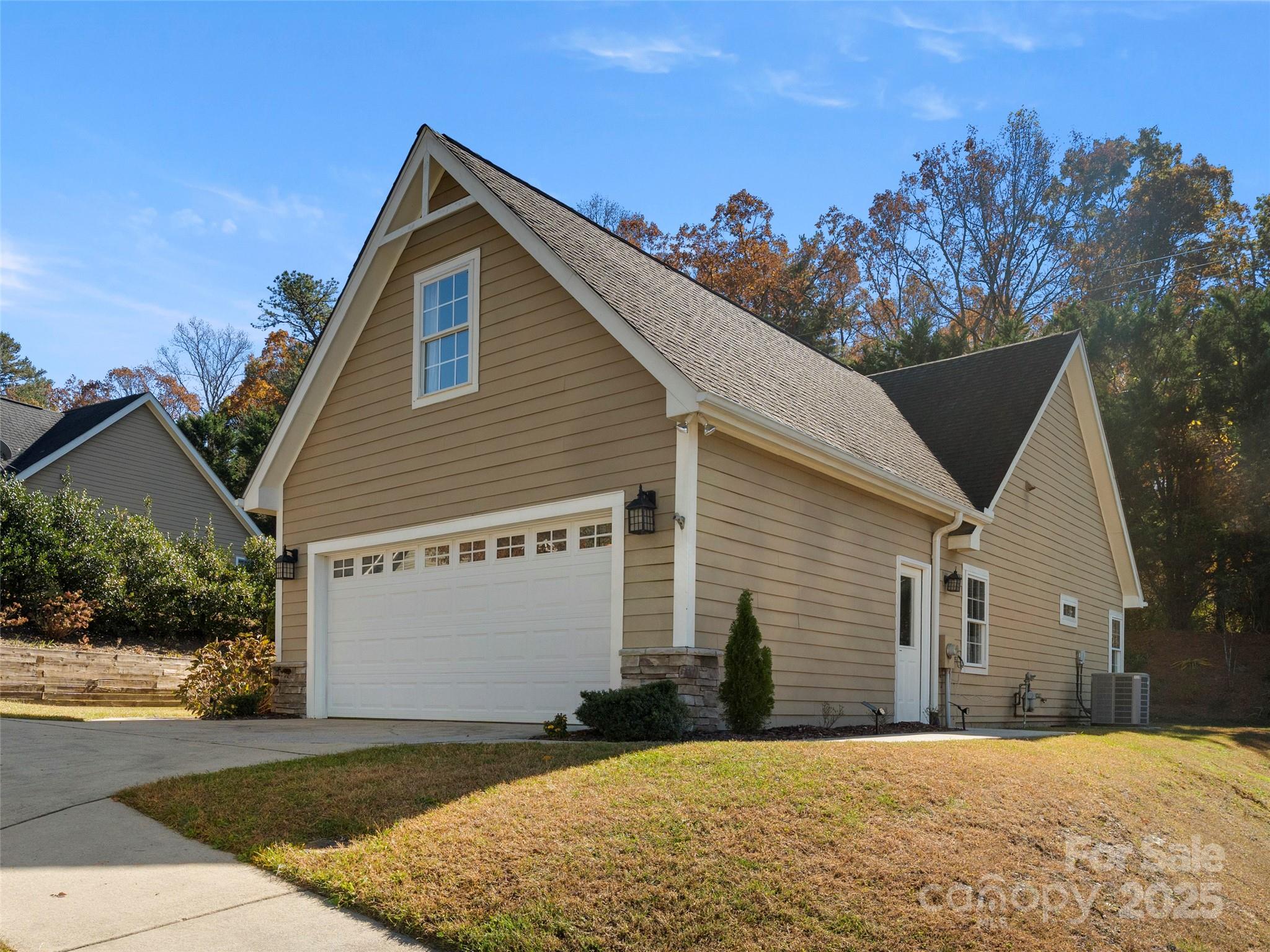 57 Regent Drive Fletcher, NC 28732 - Photo 3 of 33 a front view of a house with a yard and garage