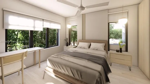 a bedroom with a large bed and a large window