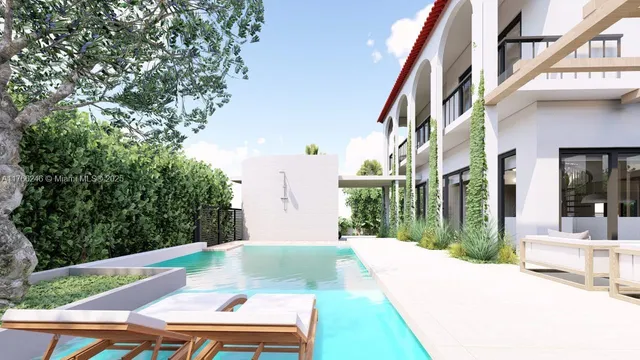 a view of a patio with a table and chairs and potted plants