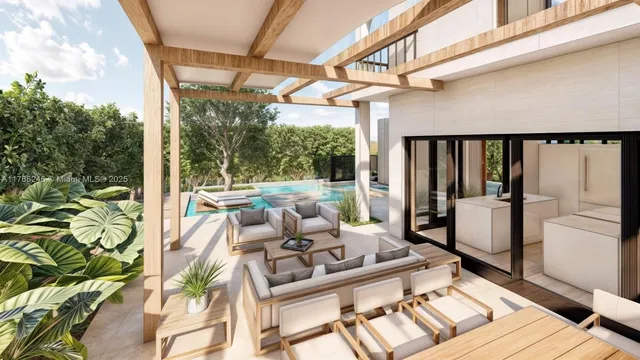 a view of a patio with a table chairs and glass door