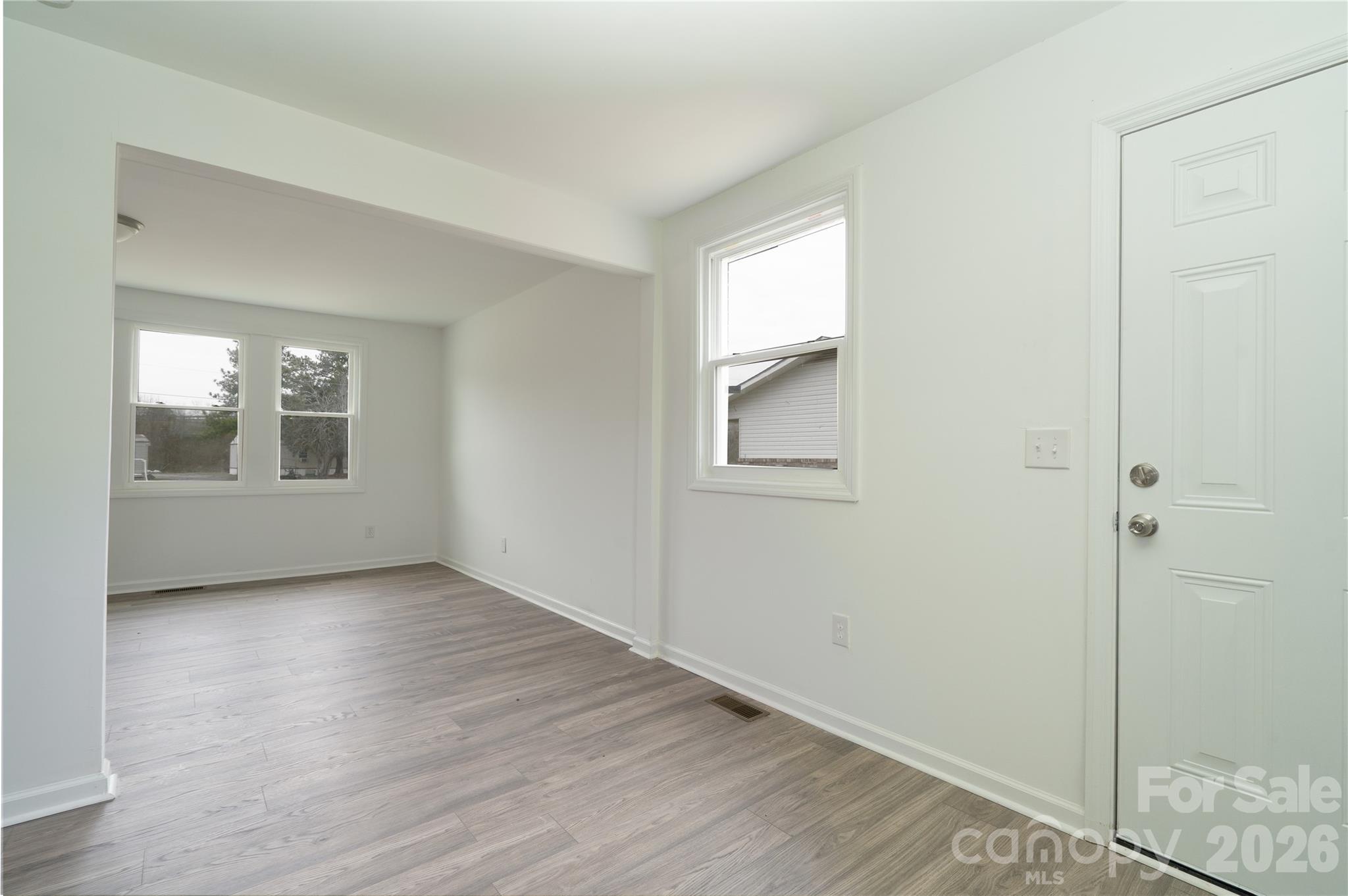 421 Pineville Road Darlington, SC 29532 - Photo 14 of 36 a view of an empty room with wooden floor and a window