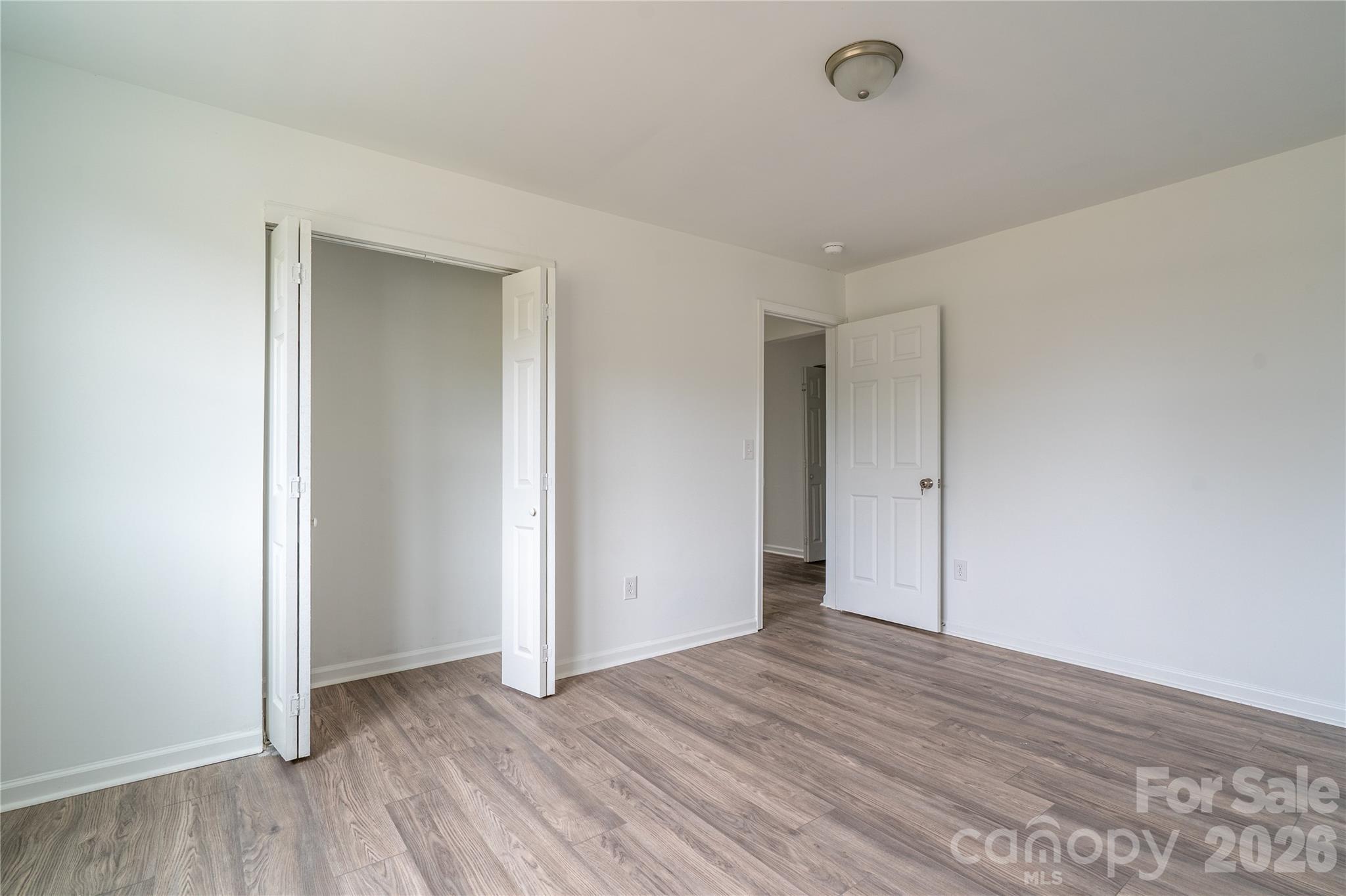 421 Pineville Road Darlington, SC 29532 - Photo 20 of 36 a view of an empty room with wooden floor and closet