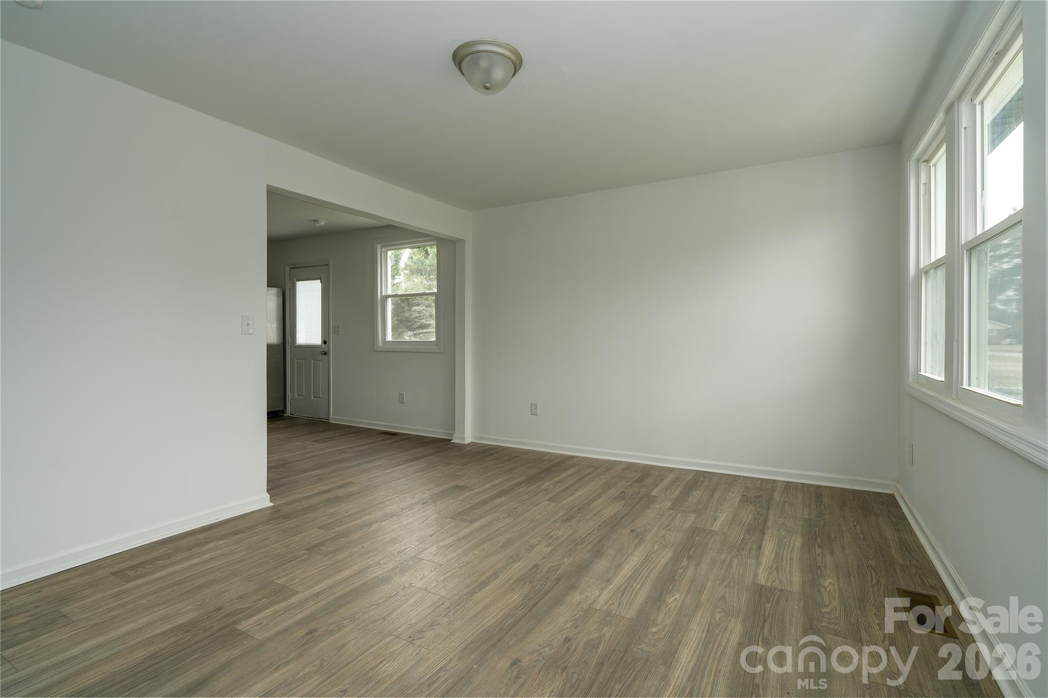 421 Pineville Road Darlington, SC 29532 - Photo 22 of 36 an empty room with wooden floor and windows