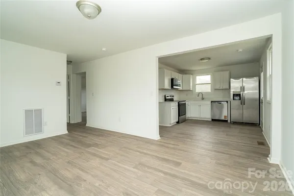 a kitchen with a refrigerator sink and microwave
