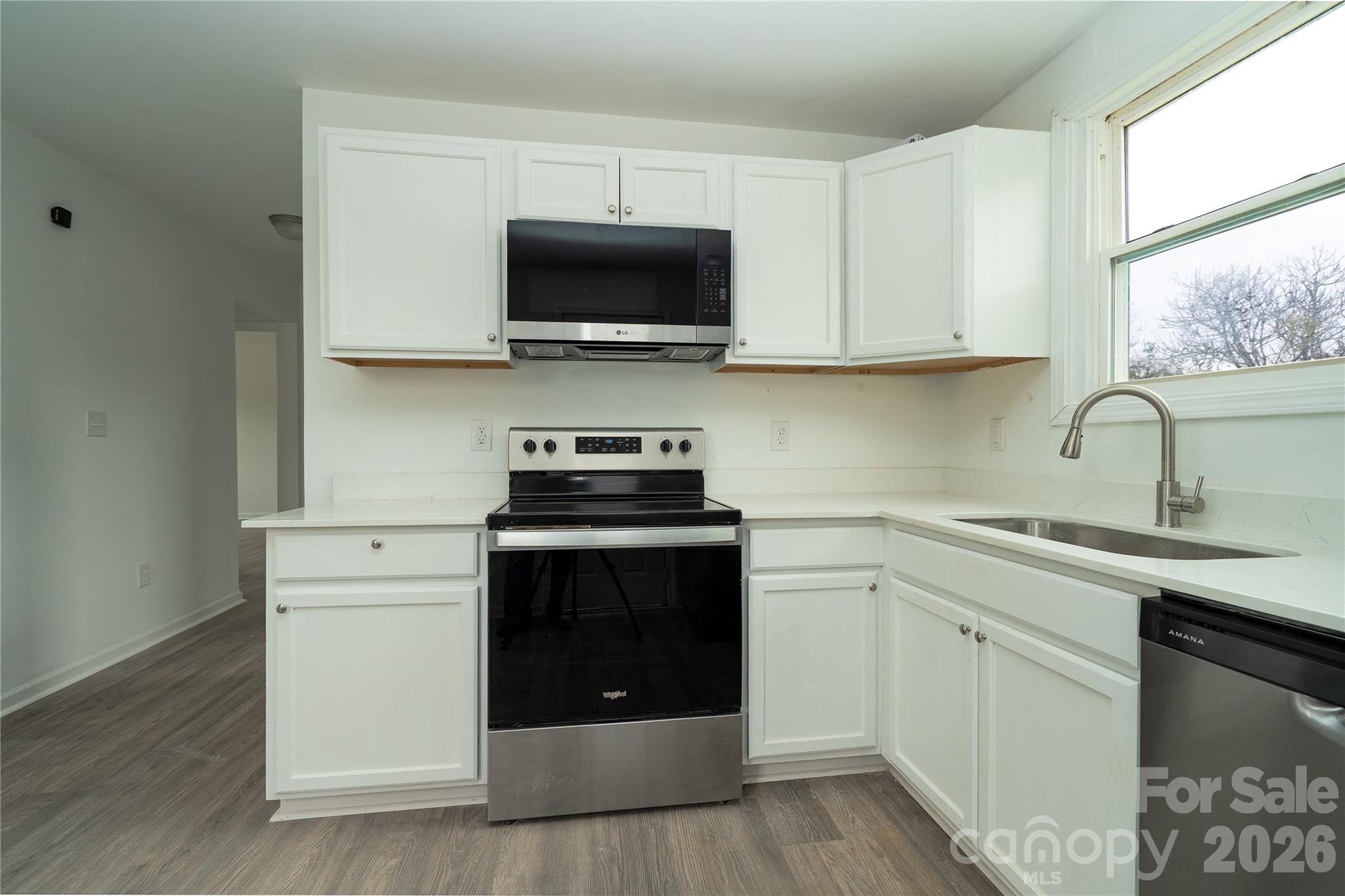 421 Pineville Road Darlington, SC 29532 - Photo 28 of 36 a kitchen with stainless steel appliances granite countertop a sink and a microwave