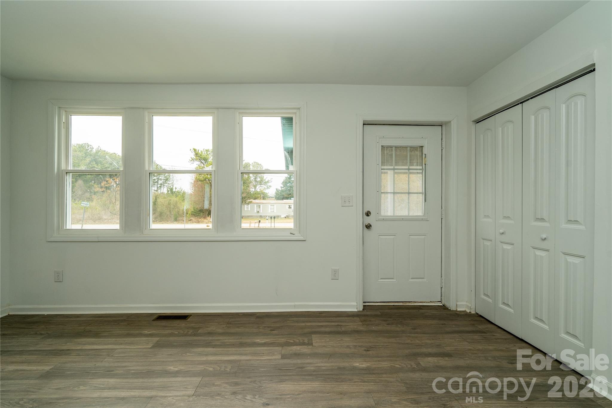 421 Pineville Road Darlington, SC 29532 - Photo 35 of 36 a view of an empty room with window and wooden floor
