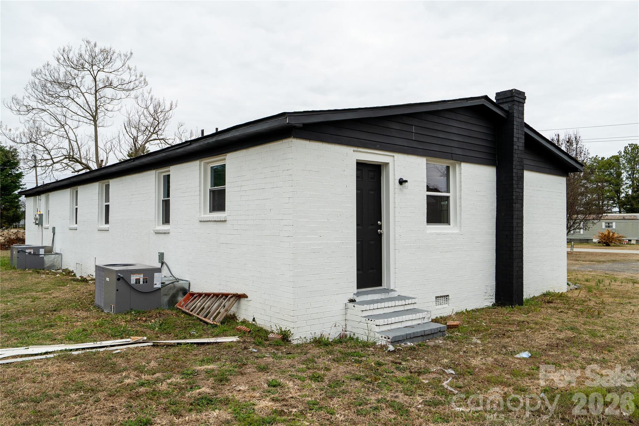 421 Pineville Road Darlington, SC 29532 - Photo 8 of 36 a view of a house with trees in the background
