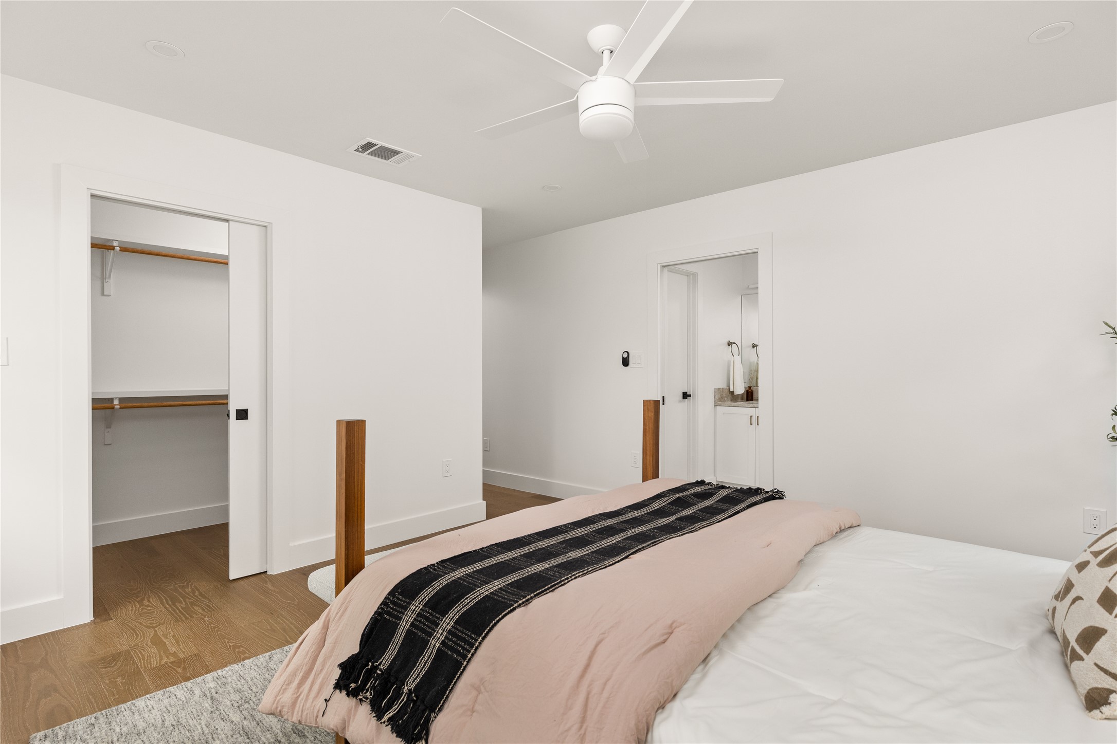 4501 Pack Saddle Pass Austin, TX 78745 - Photo 23 of 37 Bedroom featuring wood-finish flooring, recessed lighting, and a contemporary ceiling fan