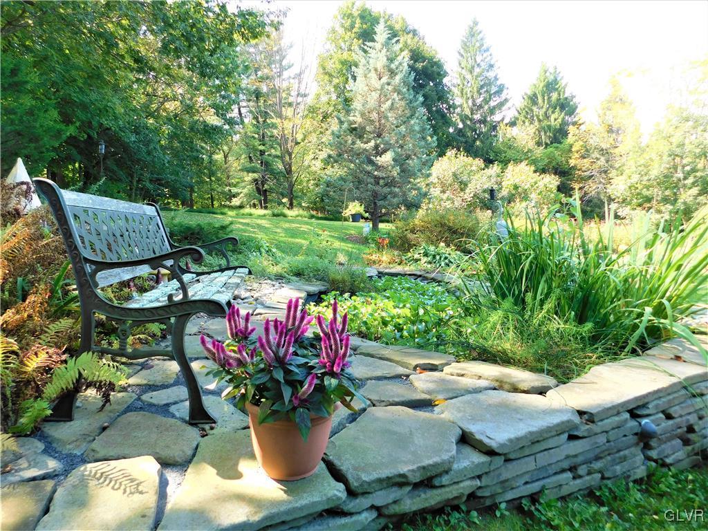 1123 Bangor Road Nazareth, PA 18064 - Photo 46 of 49 a view of a chairs and table in a backyard