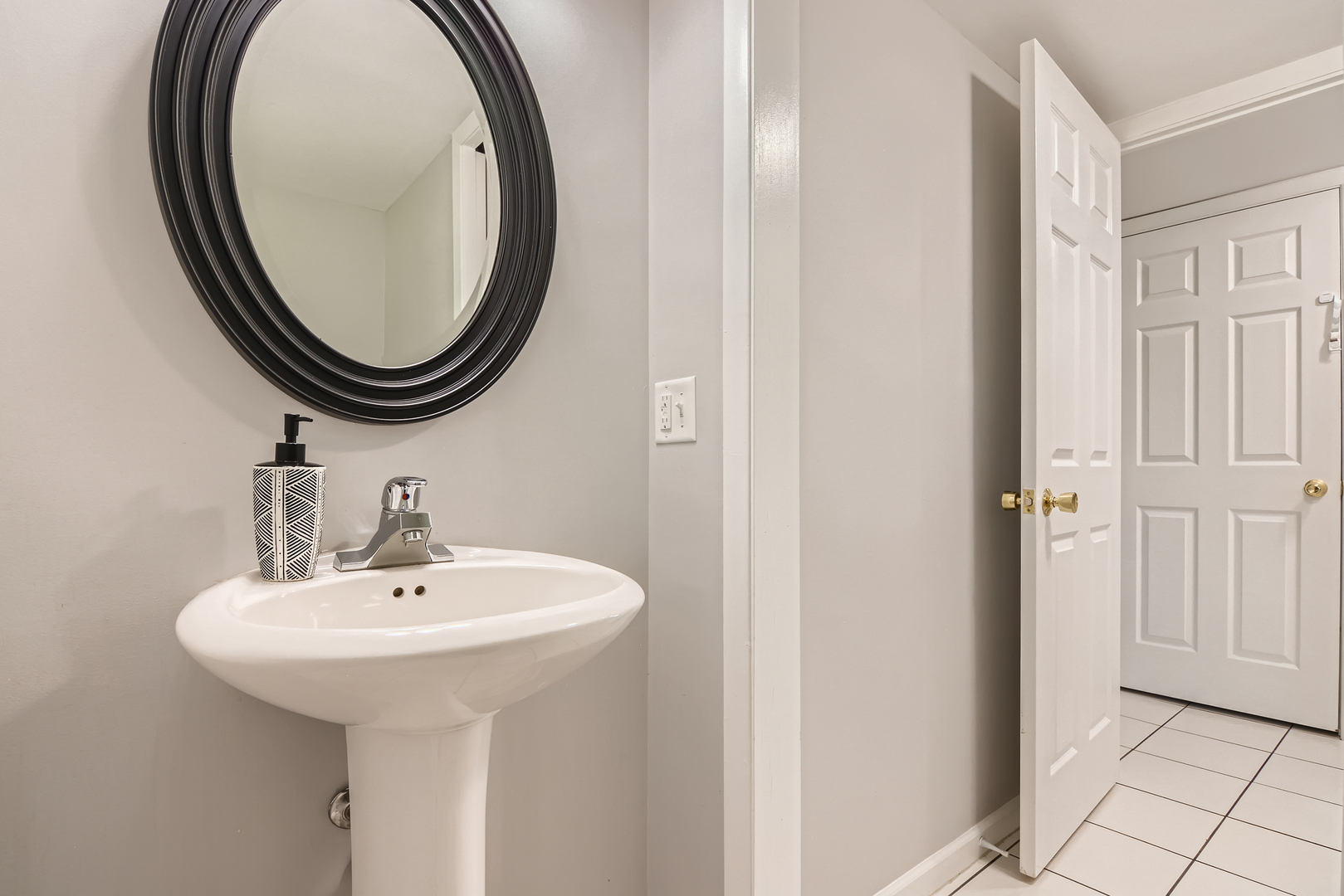 424 North Salem Drive Schaumburg, IL 60169 - Photo 13 of 26 a bathroom with a sink and a mirror