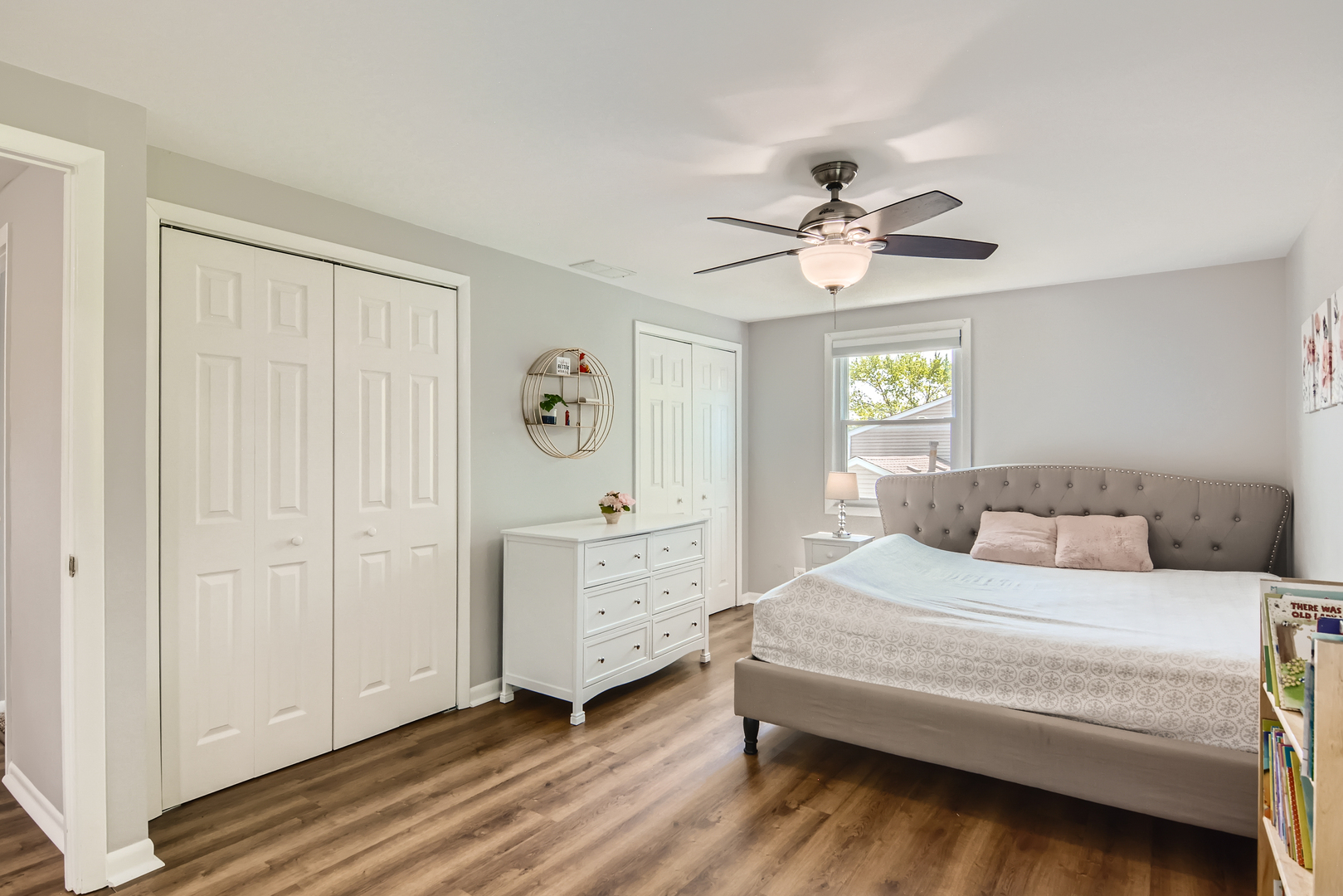 424 North Salem Drive Schaumburg, IL 60169 - Photo 15 of 26 a bedroom with a bed and a chandelier fan