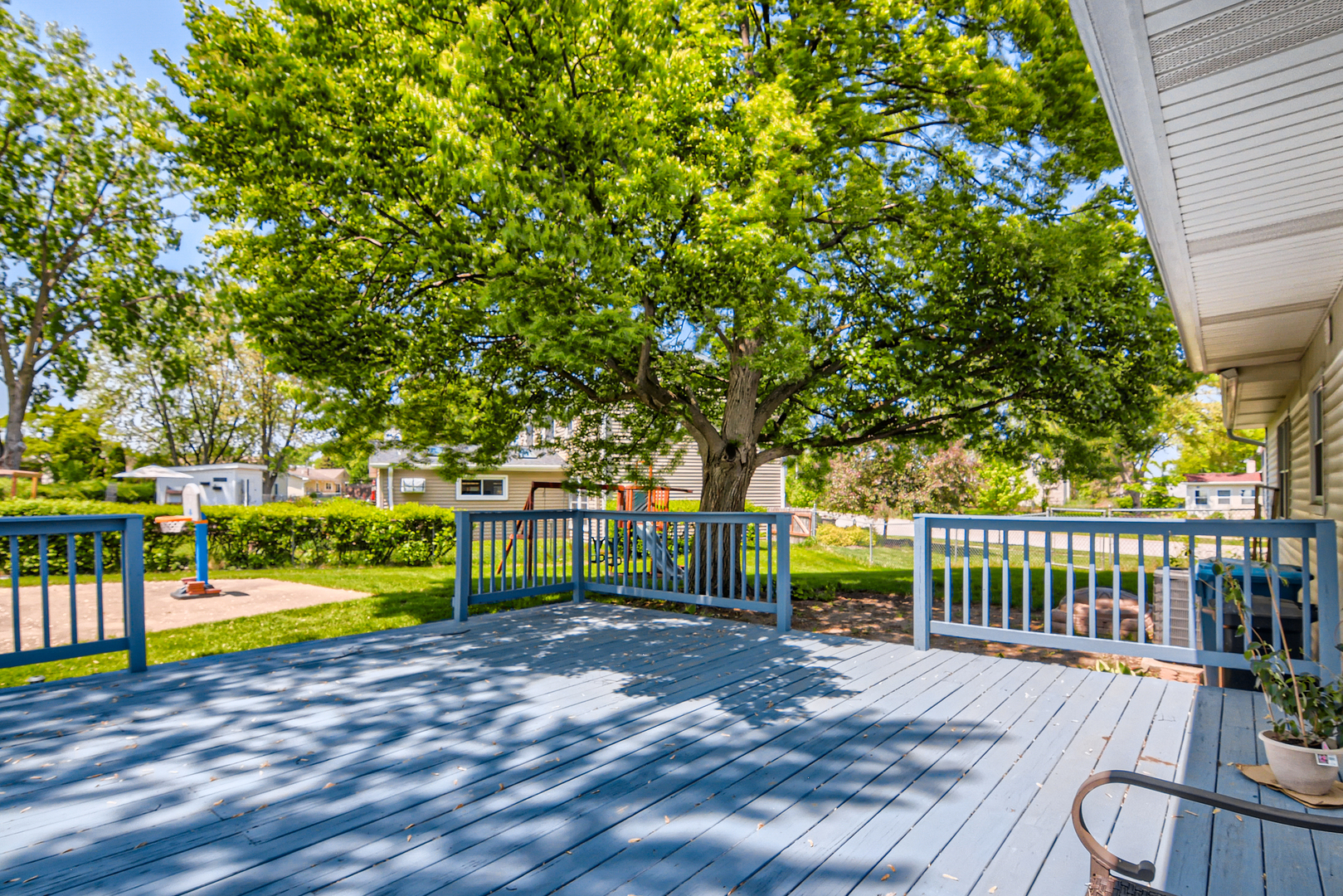 424 North Salem Drive Schaumburg, IL 60169 - Photo 23 of 26 a view of a park with large trees and a wooden fence