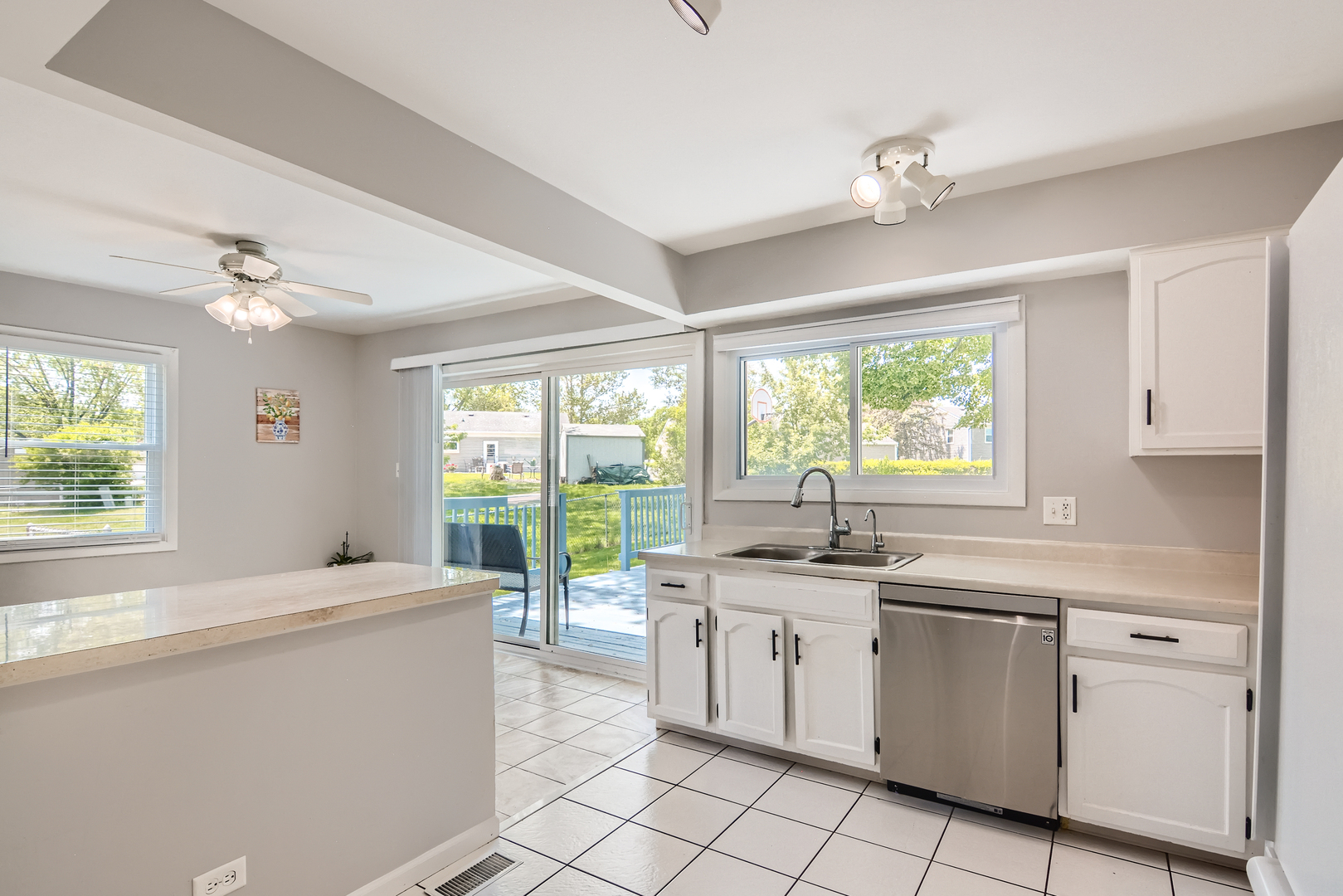 424 North Salem Drive Schaumburg, IL 60169 - Photo 7 of 26 a kitchen with a stove a sink and cabinets