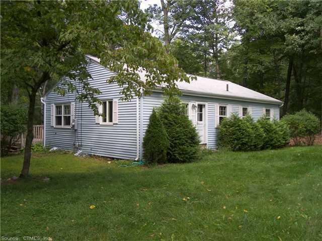 444 Huckleberry Hill Road Avon, CT 06001 - Photo 1 of 1 a house that has a tree in it