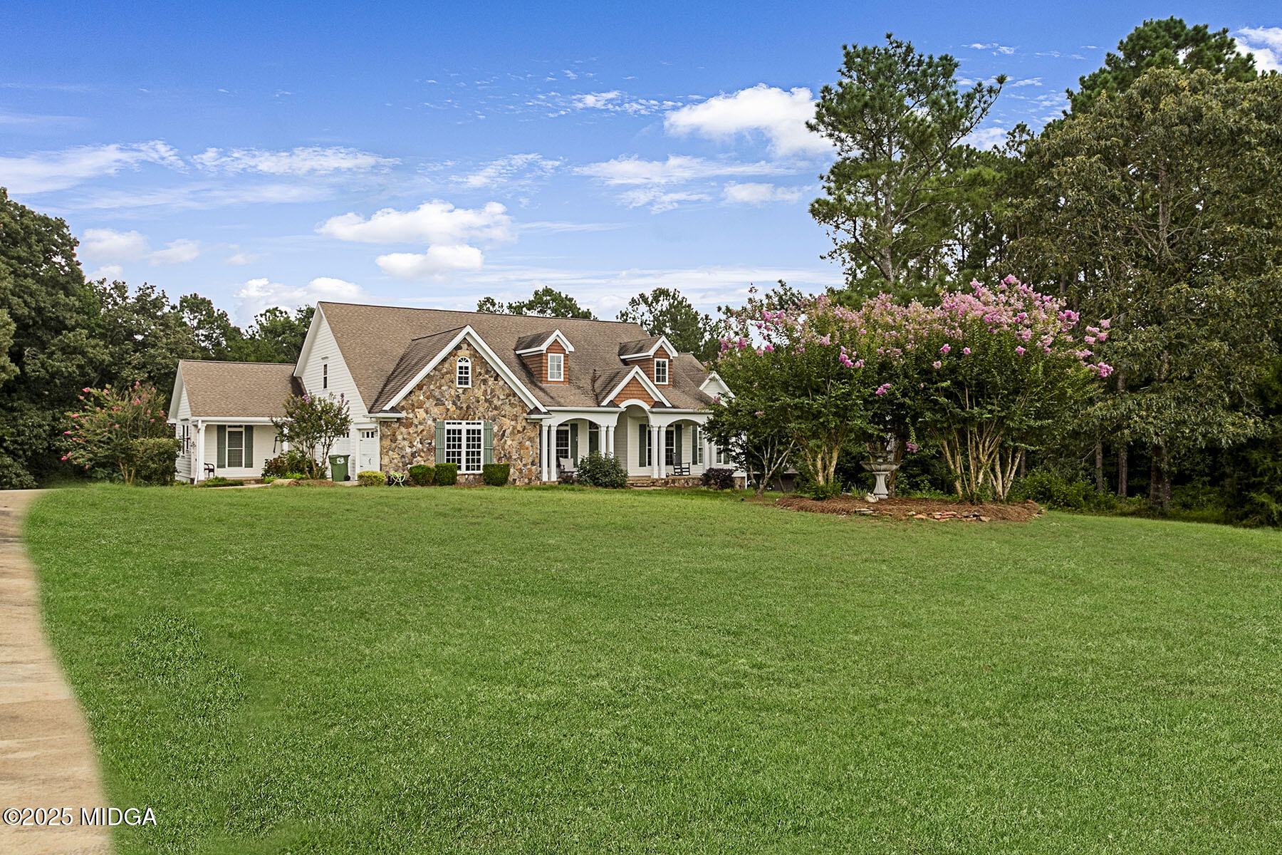 532 King Road Forsyth, GA 31029 - Photo 1 of 47 a view of a white house in front of a big yard with plants and large trees