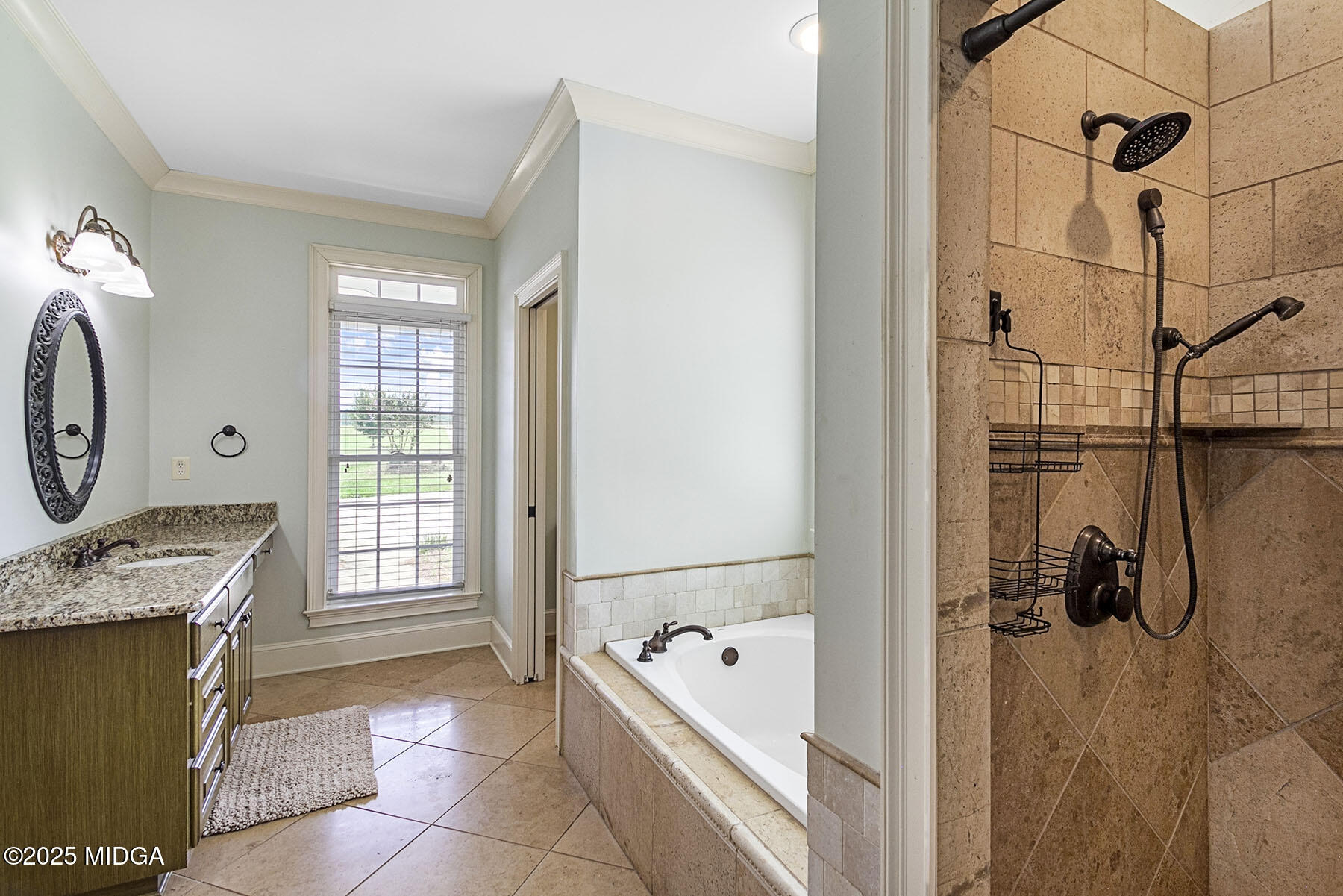 532 King Road Forsyth, GA 31029 - Photo 21 of 47 a bathroom with a tub sink and mirror