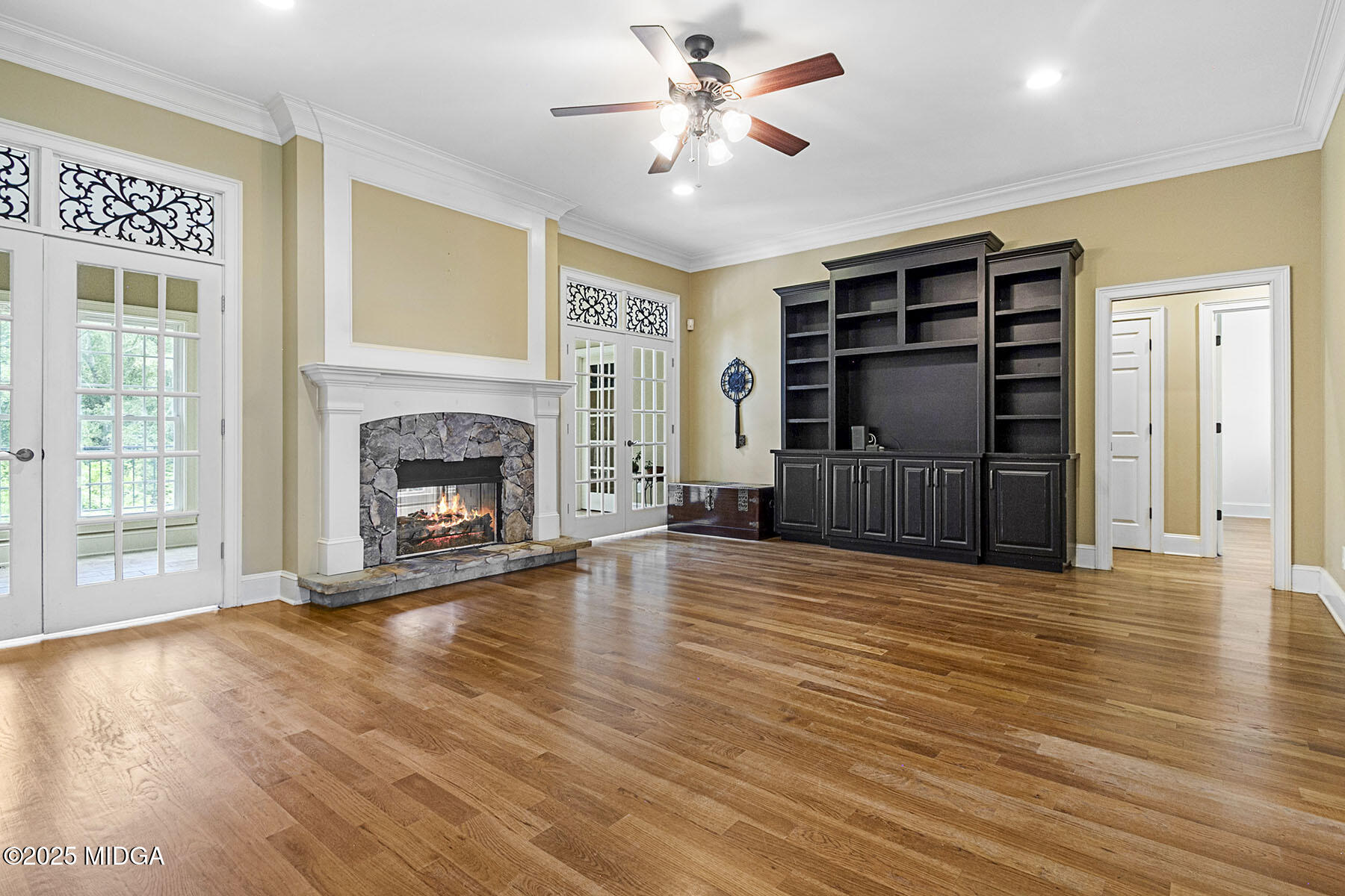 532 King Road Forsyth, GA 31029 - Photo 24 of 47 a view of a livingroom with a fireplace a ceiling fan and wooden floor