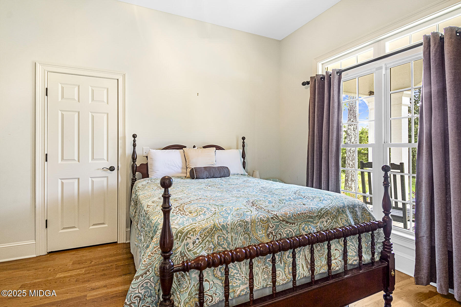 532 King Road Forsyth, GA 31029 - Photo 25 of 47 a bedroom with a bed and wooden floor