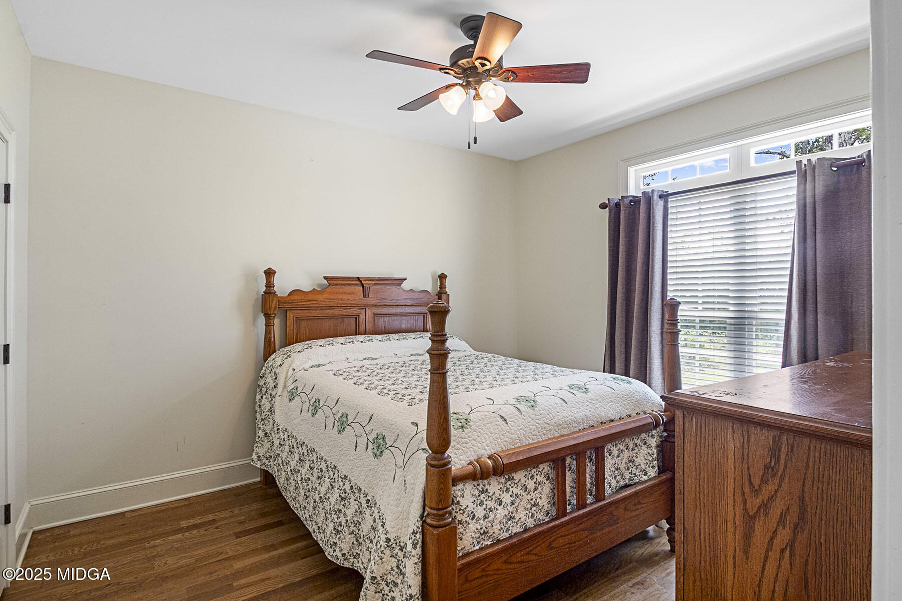 532 King Road Forsyth, GA 31029 - Photo 27 of 47 a bed sitting in a bedroom next to a window