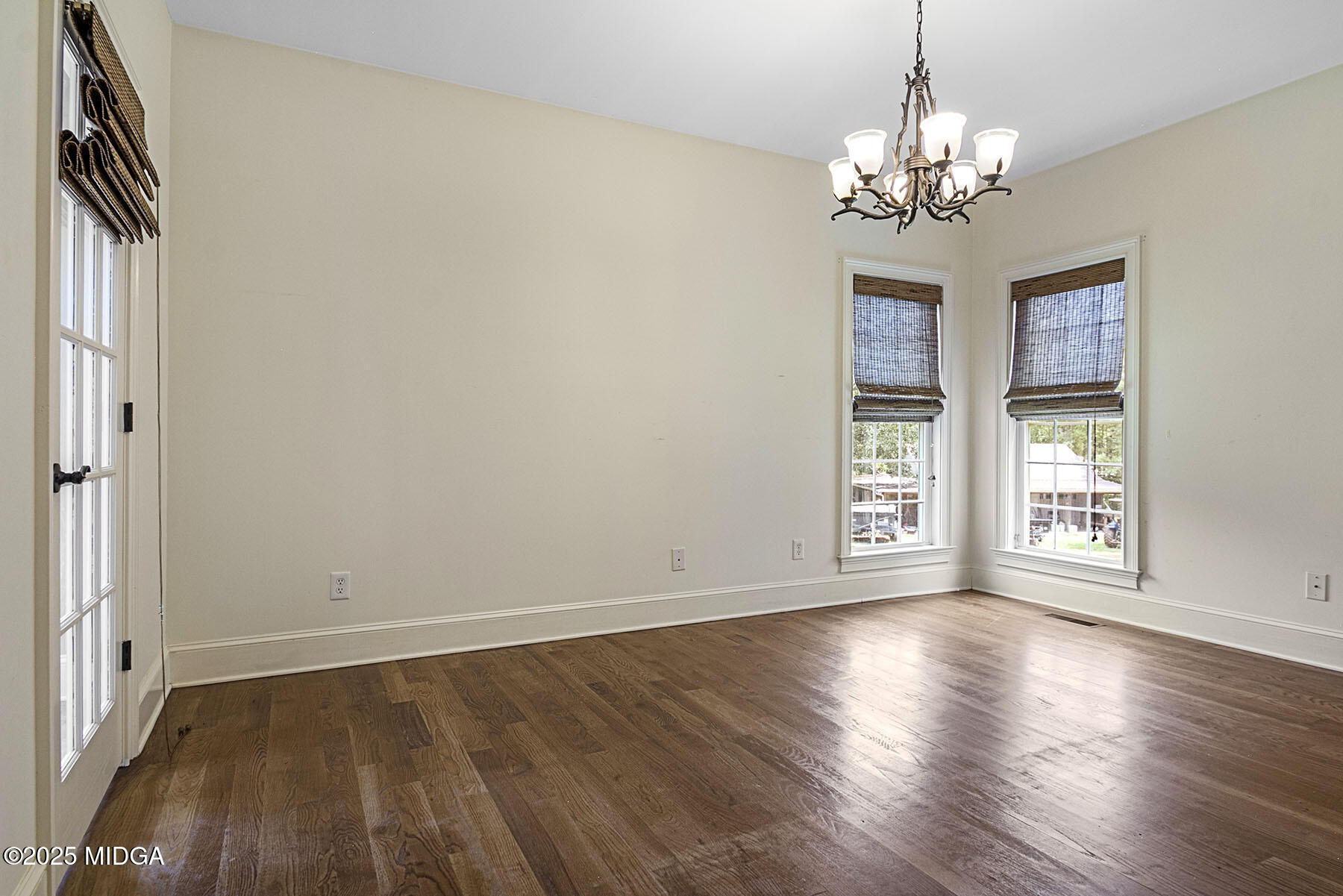 532 King Road Forsyth, GA 31029 - Photo 29 of 47 a view of an empty room with wooden floor and a window