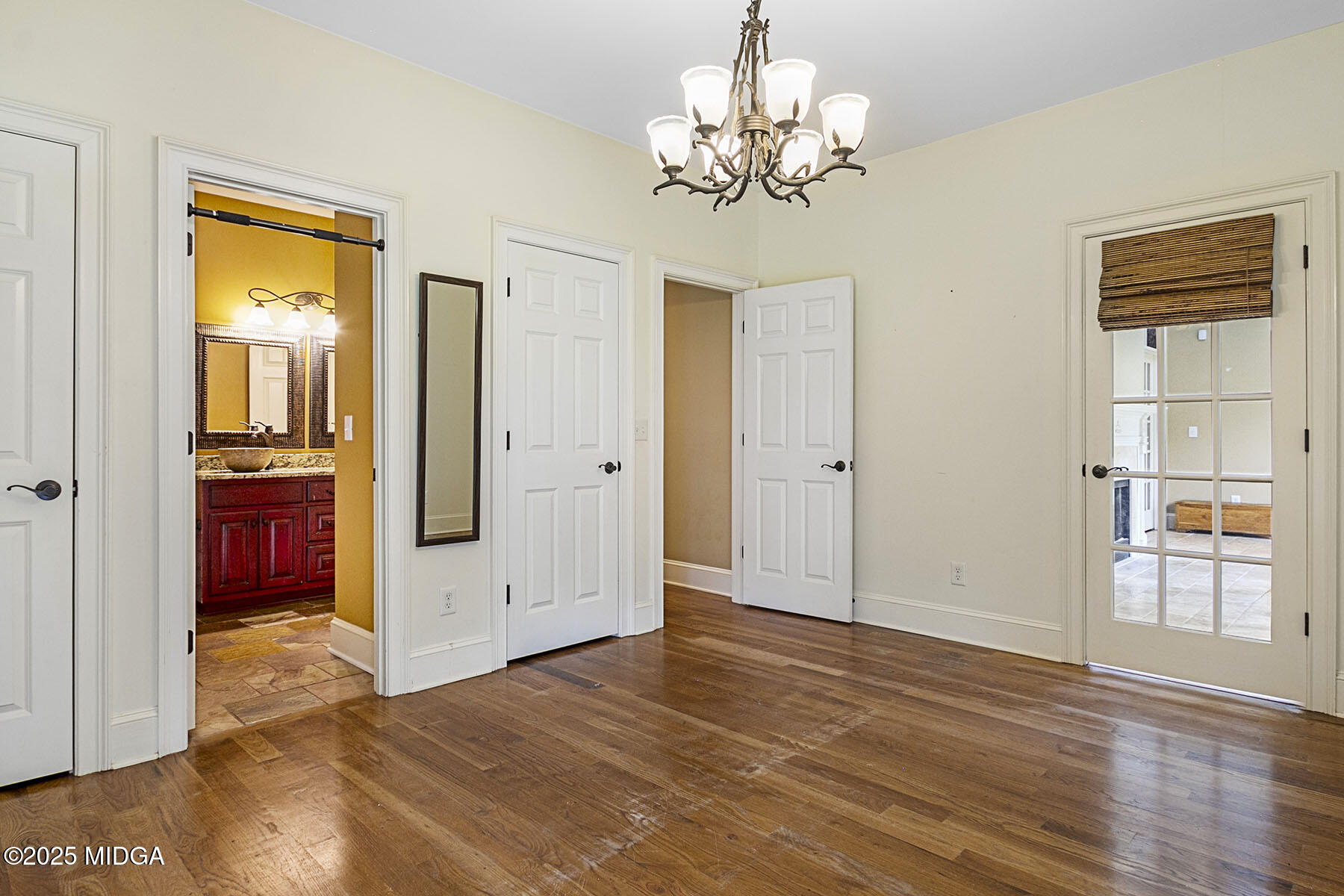532 King Road Forsyth, GA 31029 - Photo 30 of 47 an empty room with wooden floor cabinet and windows