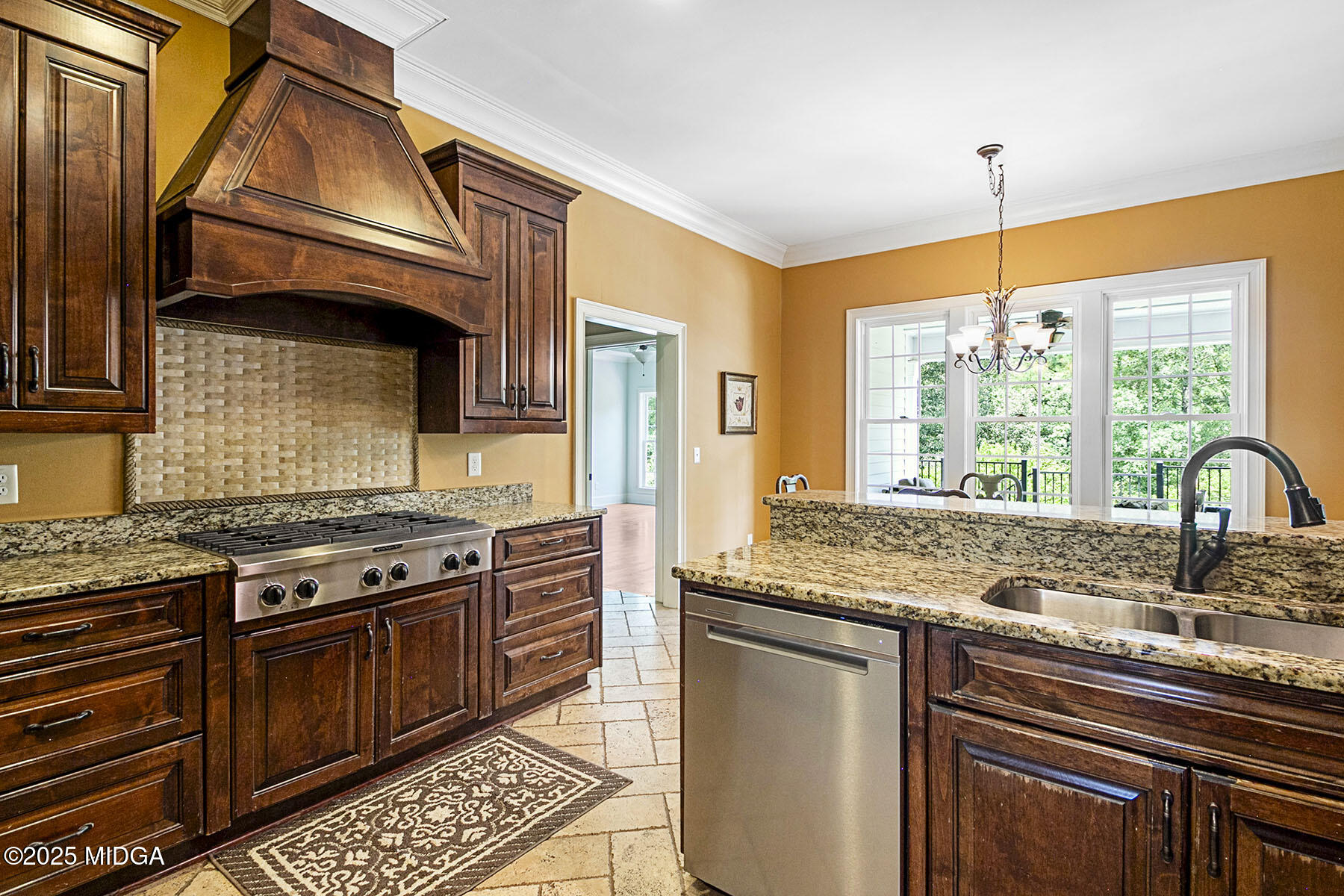 532 King Road Forsyth, GA 31029 - Photo 9 of 47 a kitchen with stainless steel appliances granite countertop a stove a sink and a microwave