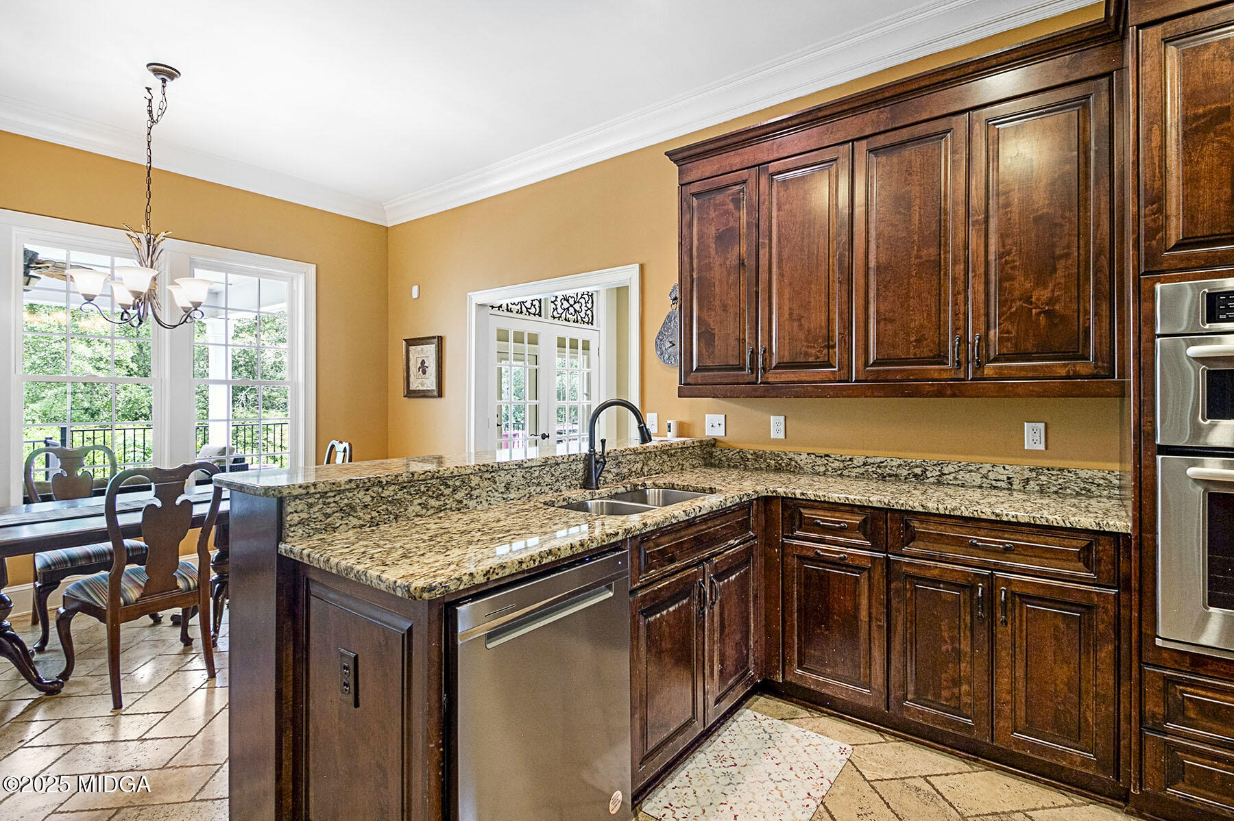 532 King Road Forsyth, GA 31029 - Photo 10 of 47 a kitchen with stainless steel appliances granite countertop a stove sink and cabinets