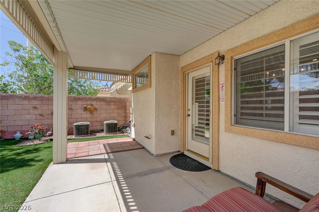 1479 Orange Jubilee Road Henderson, NV 89014 - Photo 32 of 36 A well-shaded patio area provides an ideal outdoor relaxation space.
