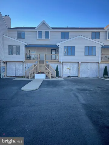 a view of kitchen with cabinets