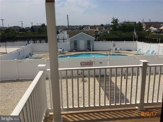 a terrace with a table and chairs