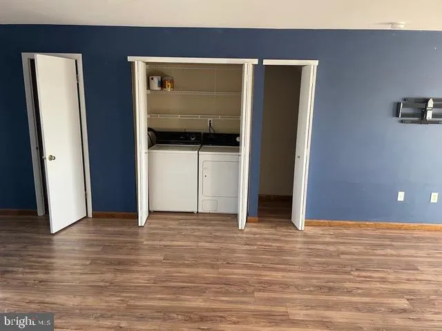 a view of hallway with wooden floor